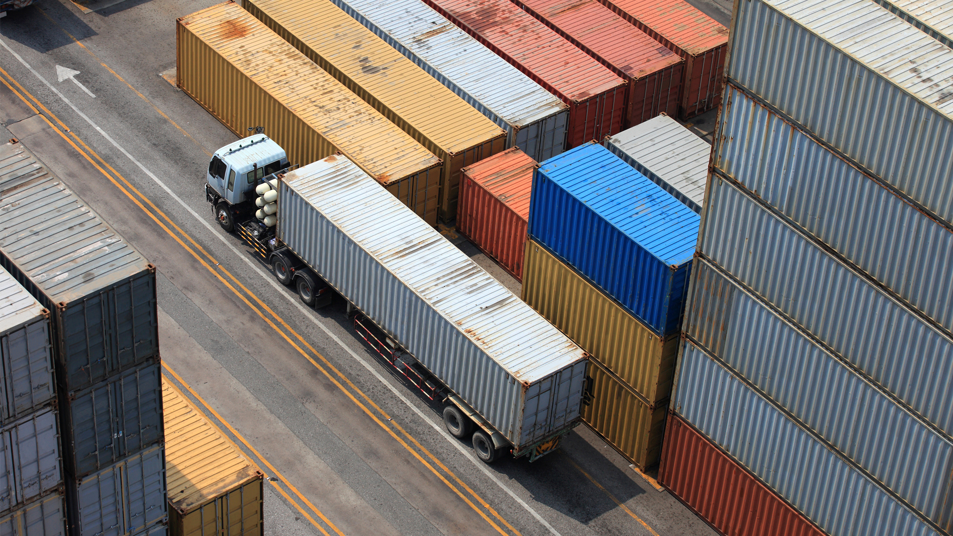 a truck carrying a freight container