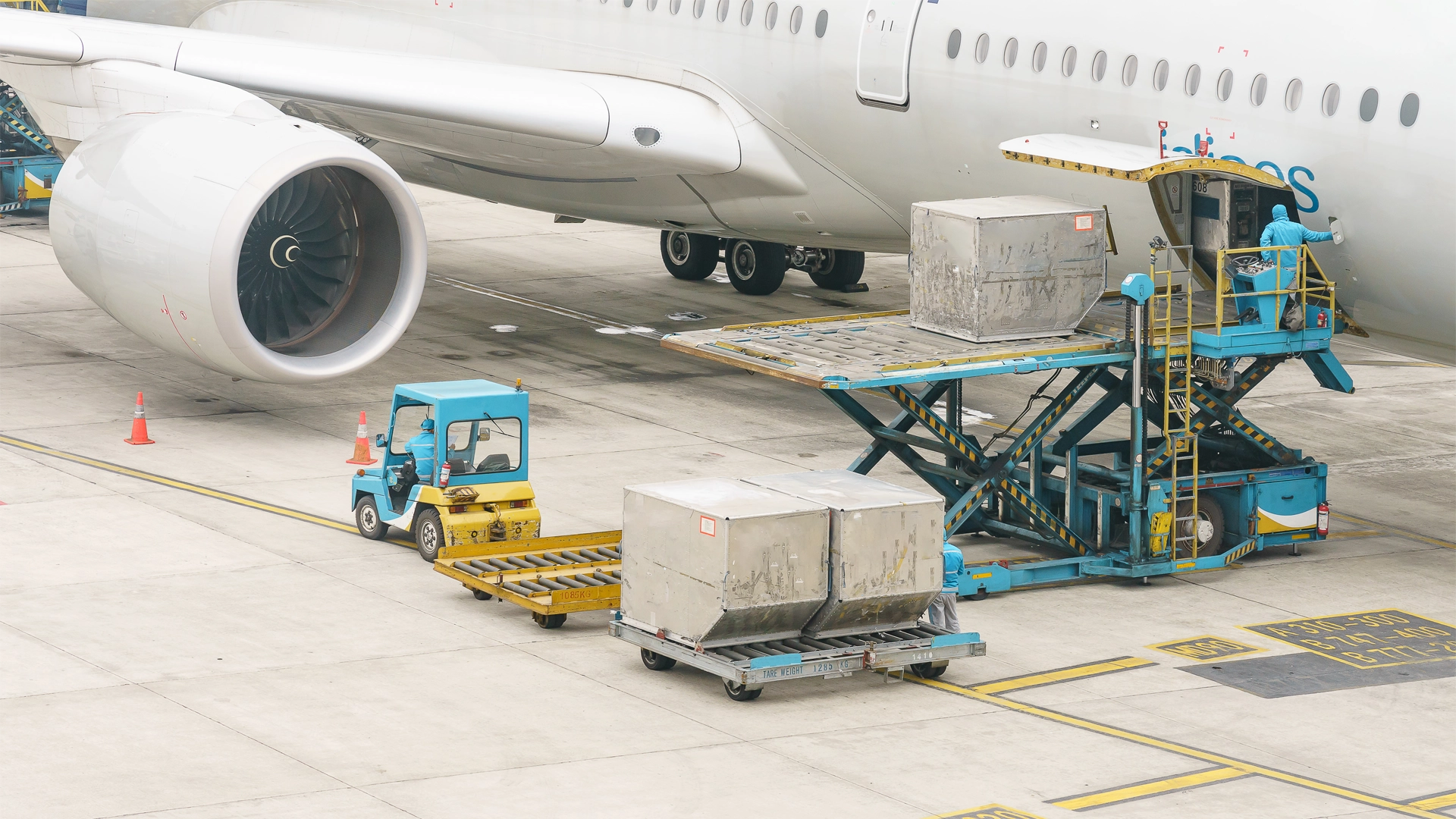 A plane being loaded with cargo